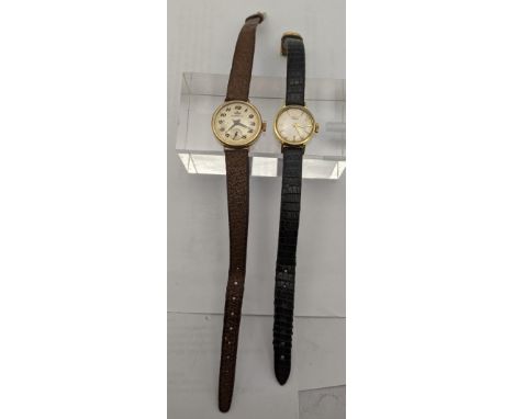 An 18ct gold ladies Longines manual wind wrist watch with a 9ct gold Marvin wrist watchLocation: 