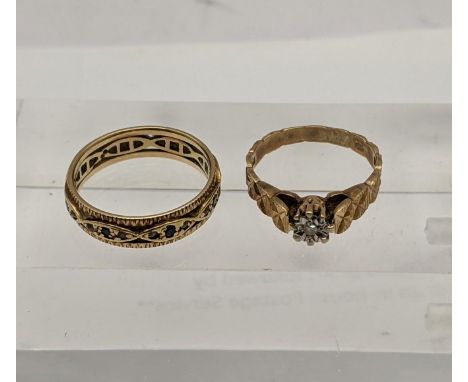 Two 9ct gold rings to include a full eternity ring set with blue sapphires and garnets and one other, total weight 4.9gLocati