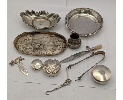 Silver to include a coaster, a dish, a Victorian dish, two pill boxes, a page marker, a glove button hook, sugar tongs, a wal