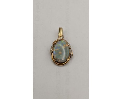 A 15ct gold pendant set with a large oval opal and diamonds, 5.1gLocation: 