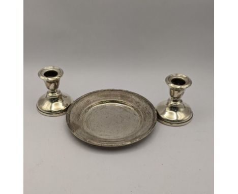 A silver pin dish 100.9g together with a pair of silver candle stick holdersLocation: 