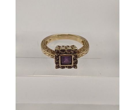 A 9ct gold ring set with a set with a square cut Amethyst flanked with pink coloured stones 4.7gLocation: 