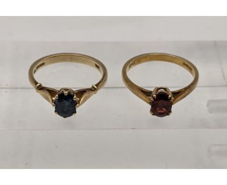 Two 9ct gold rings one set with a blue sapphire and the other a red garnet, total weight 4.5gLocation: 