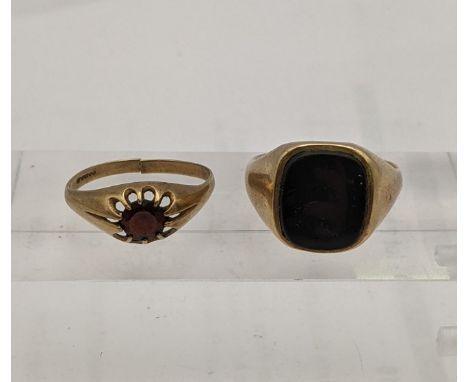 A 9ct gold signet ring and another set with a garnet 8.5gLocation: 