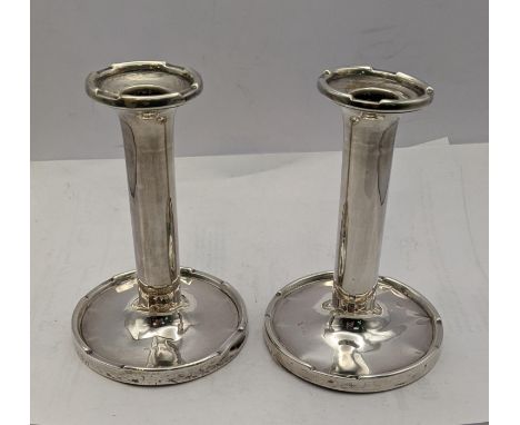 A pair of silver candle stick holders hallmarked Birmingham 1924Location: 