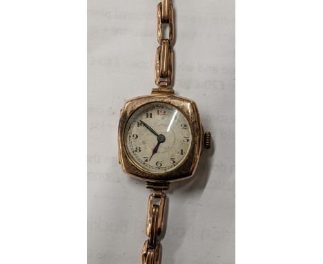 An early 20th century Rotary 9ct gold manual wind wristwatch on a yellow metal expanding bracelet 19.9gLocation: 