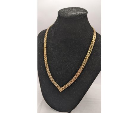 A 9ct gold collarette cross necklace in a box 38.2g Location: 