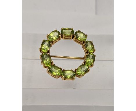 A 9ct gold and peridot bar brooch, total weight 5.1gLocation: 