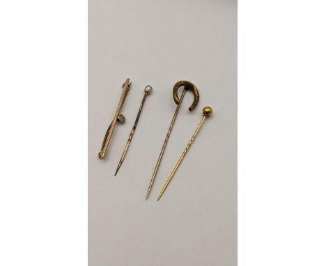 Mixed gold and yellow metal to include two 15ct stick pins, 3.1g, together with a yellow metal stick pin and bar brooch, 2.1g