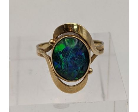 A yellow metal and opal ring tested as 9ct gold total weight 32gLocation: 