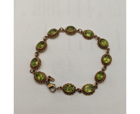 A 9ct gold and peridot bracelet, total weight 10.1gLocation: 