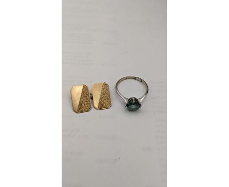 A 9ct white gold ring set with a turquoise coloured stone, together with a 9ct gold cuff link, total weight 5gLocation: 