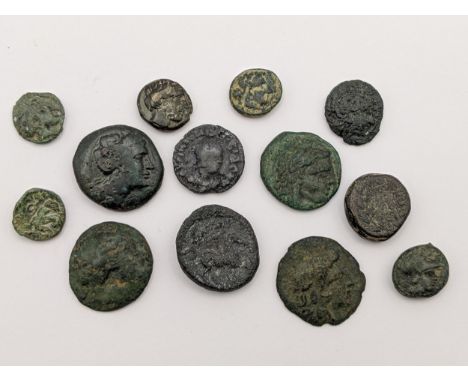 Ancient Greece - A group of twelve bronze coins to include, Apollo Tripod, Thrace Apollonia Pontika depicting an upside down 