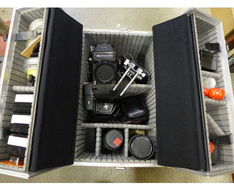 A Mamiya 645 1000s medium format film camera with three lenses; 210mm, 150mm, 80mm, a range of filters, Weston Master V light