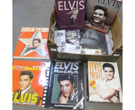 A collection of Elvis Presley books, (7), three LP records, first day covers, Marilyn Monroe postcards/photographs and a Mari