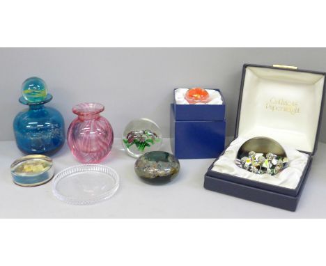 A collection of glass paperweights including Caithness and a Mdina glass scent bottle 