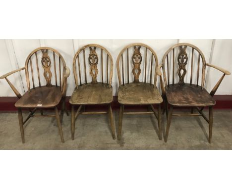 A set of four Ercol Golden Dawn elm and beech fleur de lys chairs 