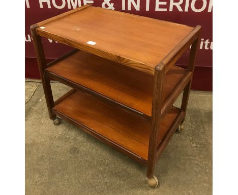 A teak three tier cocktail trolley 