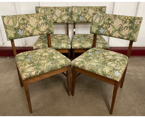 A set of four teak dining chairs, upholstered in William Morris Golden Lilley style fabric