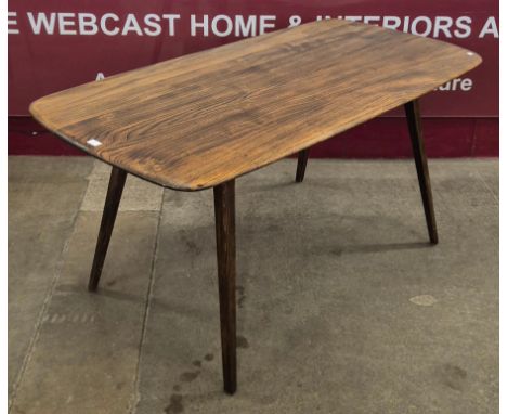 An Ercol elm and beech plank top Windsor dining table 