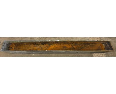 A large galvanised trough 