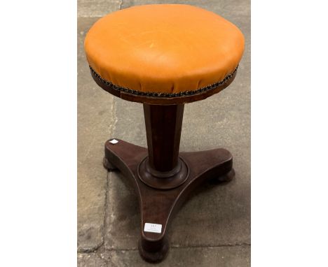 A William IV mahogany revolving piano stool 