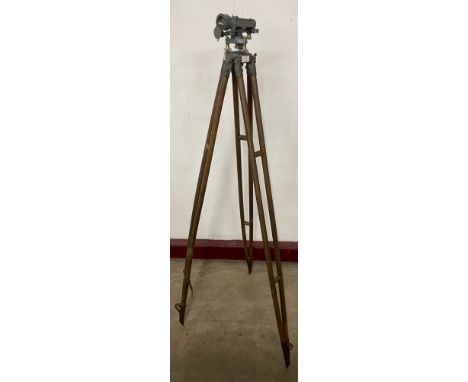 A vintage Cooke, Troughton and Simms Ltd. theodolite on beech tripod stand
