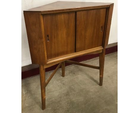 A teak corner cocktail cabinet 