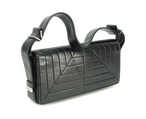 Chanel Black Lambskin Flap Bag. Silver tone hardware, "Chanel" fabric interior with zipper pocket. Labeled appropriately, ser