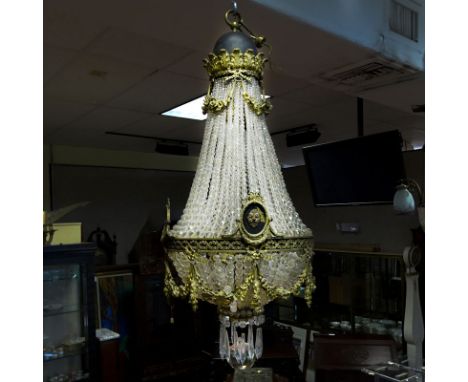 Third Quarter 19th Century French Empire Style Bronze and Beaded Crystal Chandelier. Garland ribbons and bow décor with acant