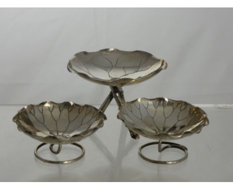 A Pair of Chinese Silver Bon Bon Dishes. The dishes take the form of water lilies with character marks stamped 85 and the let