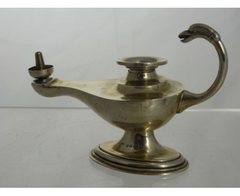 A Silver Asprey Table Cigar Lighter, takes the form of an oil lamp. Birmingham hallmark dd 1926, approx 88 gms.