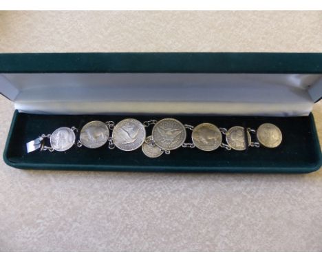 A Silver Vintage Coin Bracelet including USA, UK and Belgium together with an 1896 solid silver crown. (2).