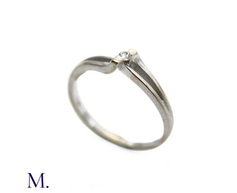 The 18ct white gold ring is set with a small round cut diamond to the centre.Box not included; for display only.Weight: 1.9g 