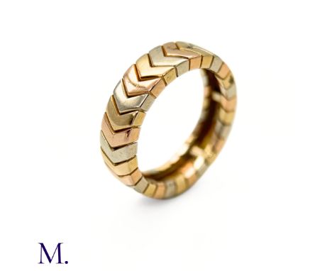 The vintage 18ct 3-colour gold ring by Cartier has a chevron design and is 5mm wide. The band is signed for Cartier.Weight: 5