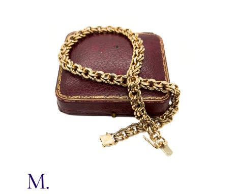 The heavy gold collar by Van Cleef and Arpels is made up of double circular links (10mm wide) and is secured with a clasp to 