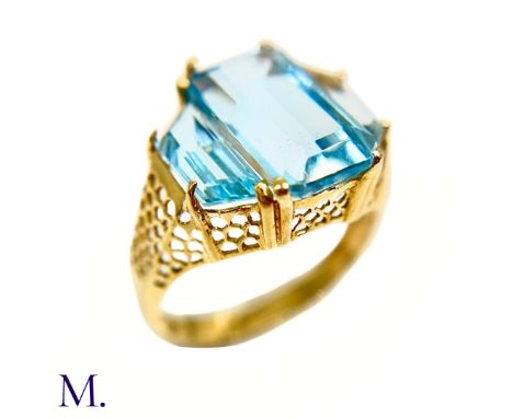 The 14ct yellow gold pierced ring is set with three topaz stones, the largest of which is approximately 5.5ct.Weight: 4.4g Si