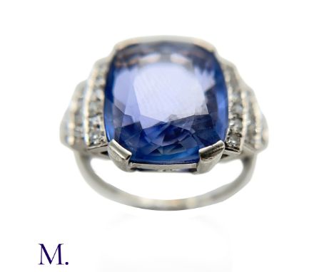 The platinum ring is set with a large oval-cut unheated indigo-blue sapphire of Ceylon origin (approx. 6.6ct) with stepped sh