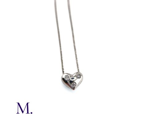 The 18ct white gold Etoile pendant by Tiffany & Co. is set with three small diamonds. The pendant measures approximately 10mm