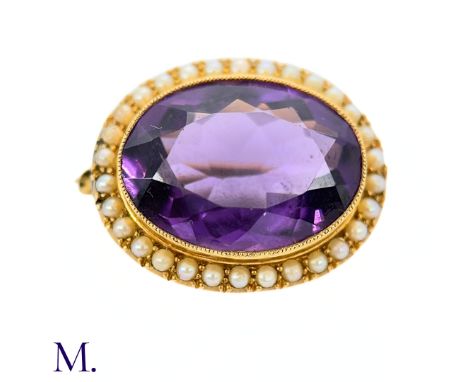 The 15ct gold brooch is set with a good colour amethyst of approximately 8.7ct, with small cream pearls in surround.Box not i