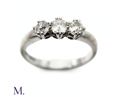 The 18ct white gold ring is set with three old cut diamonds weighing approx. 0.75ct, with the principal diamond approx. 0.30c