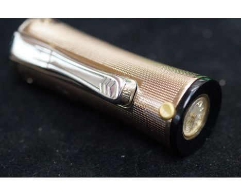 Unusual cigarette lighter/clock