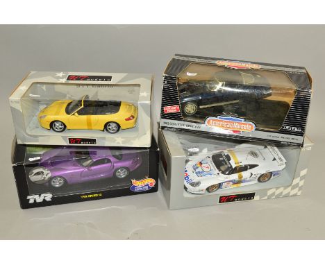 FOUR BOXED 1/18 SCALE DIECAST SPORTS CAR MODELS, UT Models Porsche 911 Cabrio and Porsche 911 GT1, Mattel Hot Wheels TVR Spee