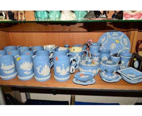 A LARGE COLLECTION OF WEDGWOOD LIGHT BLUE JASPERWARES, to include a set of fifteen Christmas annual tankards 1971 to 1985, a 