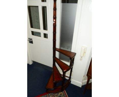 A REPRODUCTION MAHOGANY SPIRALLING LIBRARY STEPS with red tooled leather inlay to each step