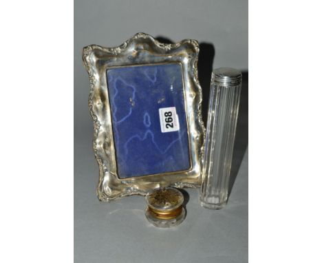 A LATE VICTORIAN SILVER TOPPED GLASS TOILET JAR, together with an Edwardian silver mounted easel back photograph frame and a 