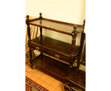 AN EARLY 20TH CENTURY MAHOGANY THREE TIER BUFFET, with two drawers on ceramic casters, width 107cm x depth 43cm x height 130c