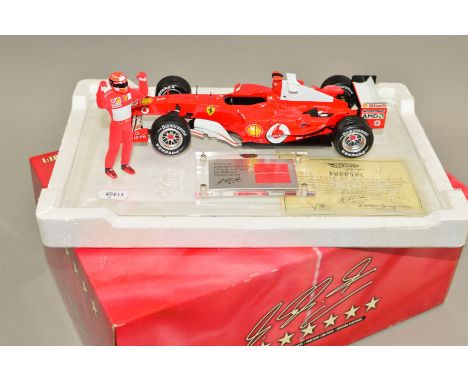 A BOXED MATTEL HOT WHEELS RACING DIECAST MICHAEL SCHUMACHER COLLECTION FERRARI F2004 F1 RACING CAR, 1/18 scale, model of Mich