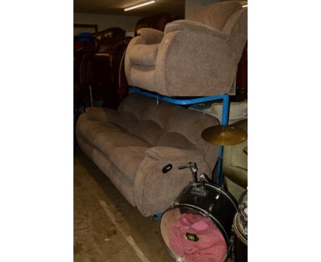 A BEIGE UPHOLSTERED TWO PIECE MANUAL RECLINING LOUNGE SUITE comprising of a three seater settee and an armchair