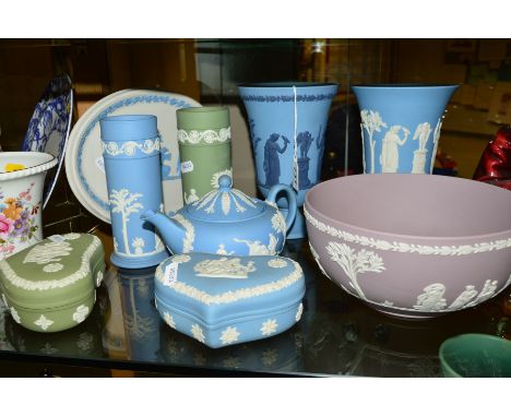 NINE PIECES WEDGWOOD JASPERWARES, to include two pedestal vases, one with dark blue applied classical figures on light blue g